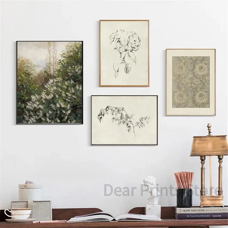 Four framed art prints featuring a vintage summer landscape canvas art print and black and white botanical sketches
