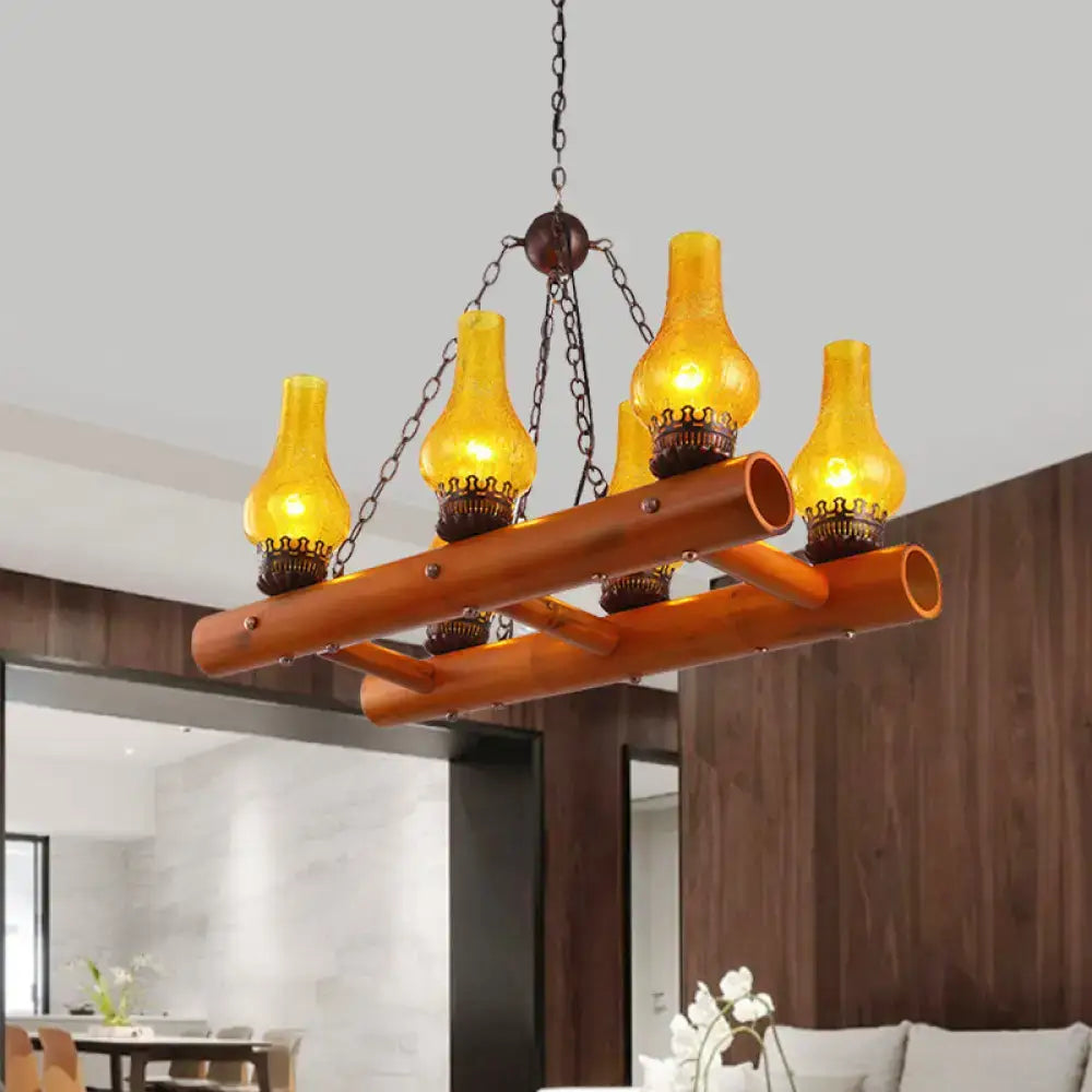 Warm amber yellow crackle glass pendant light with bamboo ladder design and dark metal chains by decorbites vintage