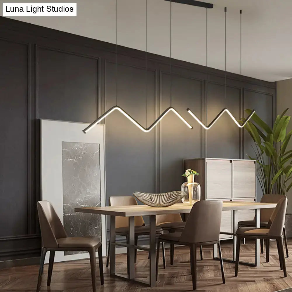 Modern DecorBites™ W-shaped pendant light fixture with sleek black metal and warm white LED illumination for dining room