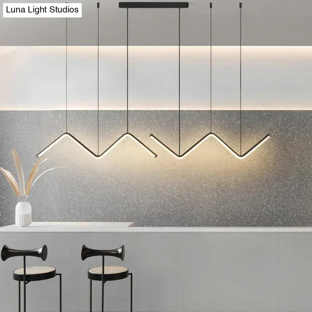 Modern black metal DecorBites W-shaped pendant light fixture with sleek minimalist design for dining room island lighting