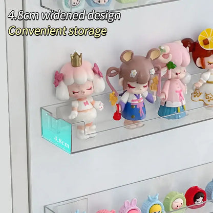 DecorBites wall mounted transparent storage rack in clear acrylic with 4.8cm widened shelf displaying figurines