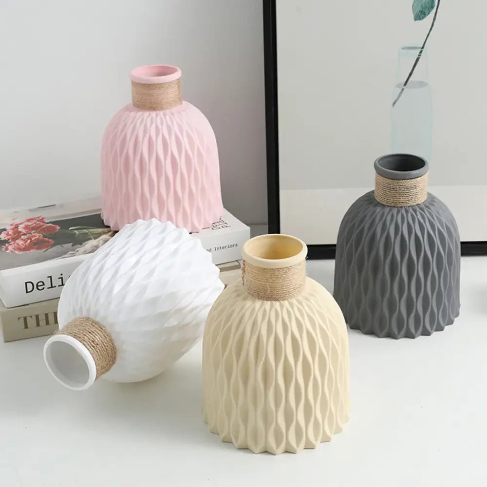 Pastel pink ripple plastic vase with textured ribbed surface and natural twine-wrapped neck by decorbites modern nordic style