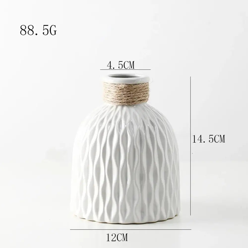 White ceramic DecorBites™ ripple plastic vase with textured wavy surface and natural twine band in modern Nordic style