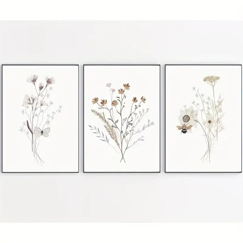 Set of three minimalist watercolor flower posters with delicate flowers butterflies and bees in slim black frames