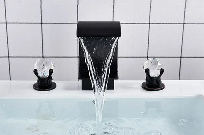 Black DecorBites™ waterfall bathroom basin faucet with crystal knob handles for hot and cold water mixing