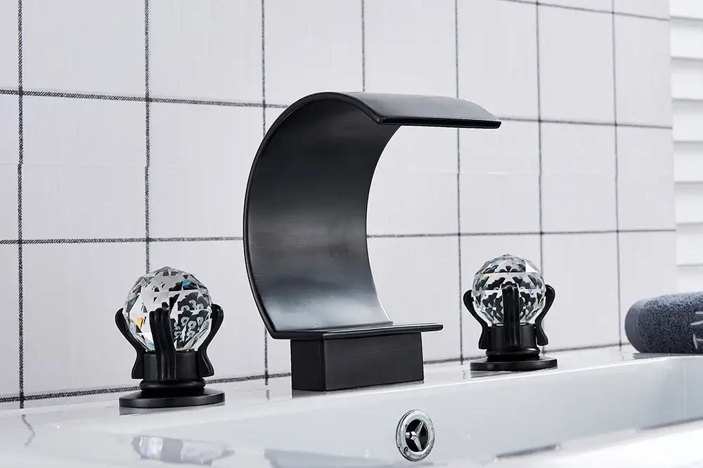 Black matte-finish DecorBites waterfall bathroom basin faucet with crystal globe handles for hot and cold mixer use