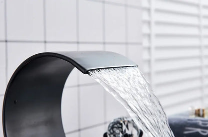 Modern black matte-finish DecorBites™ waterfall bathroom basin faucet with sleek curved design for hot cold mixer use