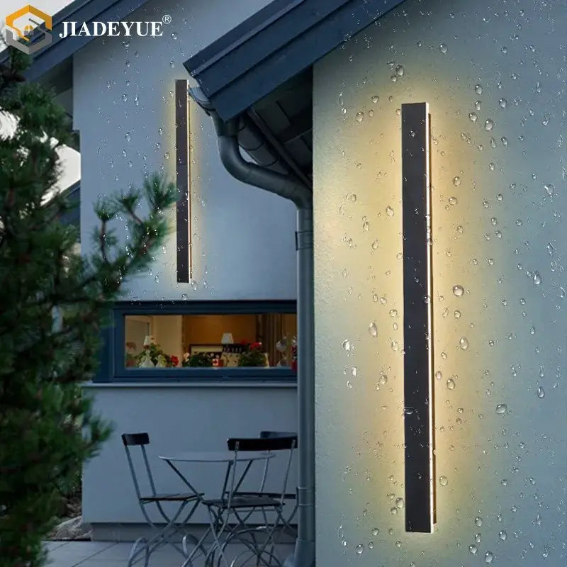 Modern black rectangular waterproof led wall light by DecorBites emitting warm ambient light for outdoor use