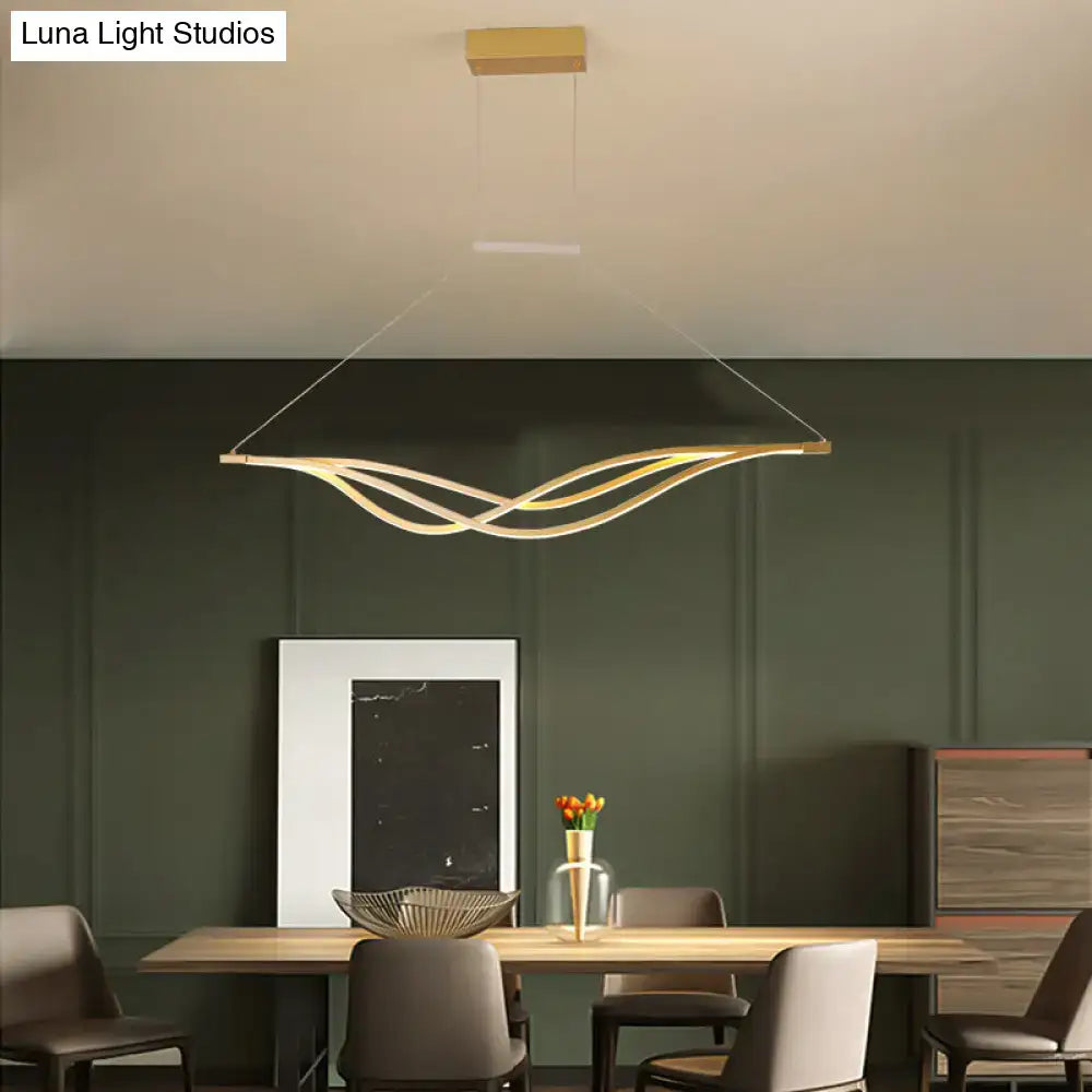 Modern gold-toned wave shaped metal led island light fixture with sleek intertwined design for dining room