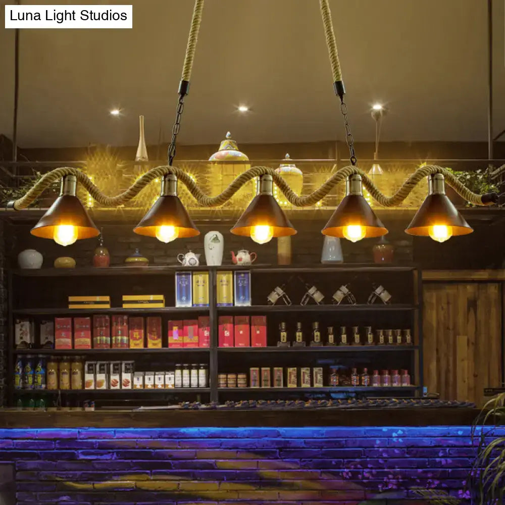 Decorbites wavy hemp rope island light fixture with five copper metal shades suspended by braided rope and chains