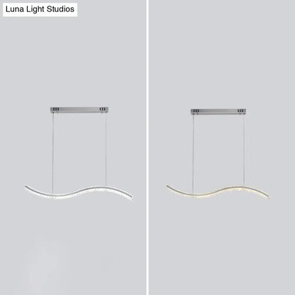 Modern silver-toned wave-shaped DecorBites™ crystal LED pendant lighting for dining room with sleek minimalist design