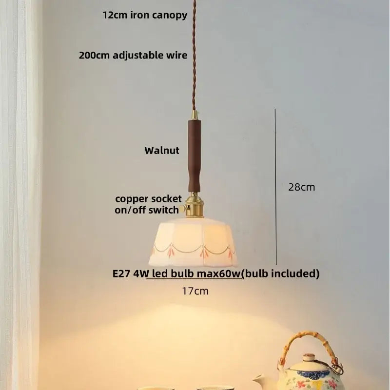Vintage warm-toned pendant light with hexagonal glass shade, orange embroidery, and white ceramic led kitchen wood accent