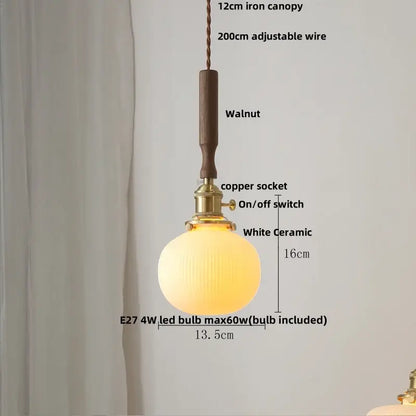 Vintage cream ribbed white ceramic led pendant light with warm glow suspended by copper socket and walnut wood accent canopy