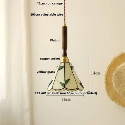 Delicate yellow stained glass pendant light with leaf motifs and walnut iron canopy paired with white ceramic led pendant light