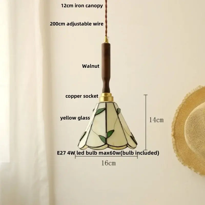 Delicate yellow stained glass pendant light with leaf motifs and walnut iron canopy paired with white ceramic led pendant light