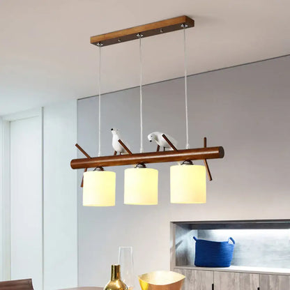 Decorbites™ white glass led pendant light with wooden bar and resin birds features three frosted cylinder restaurant shades