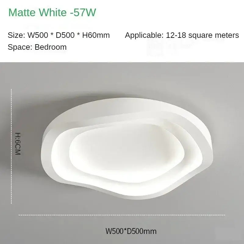 Matte white oval led ceiling lamp with layered organic design for modern minimalist home decor by DecorBites