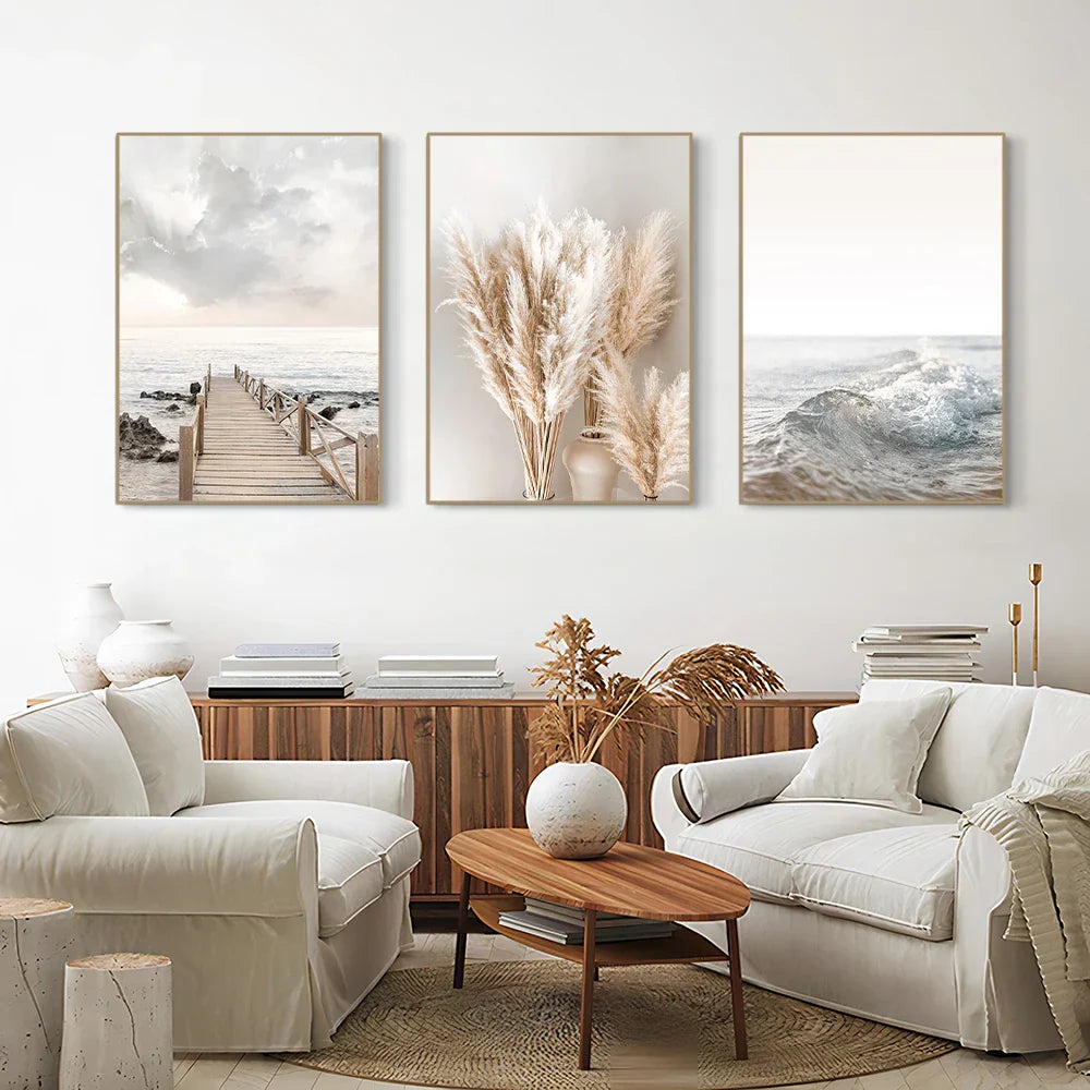 Set of three framed decorbites™ white seascape canvas prints featuring coastal and pampas grass in muted earthy tones