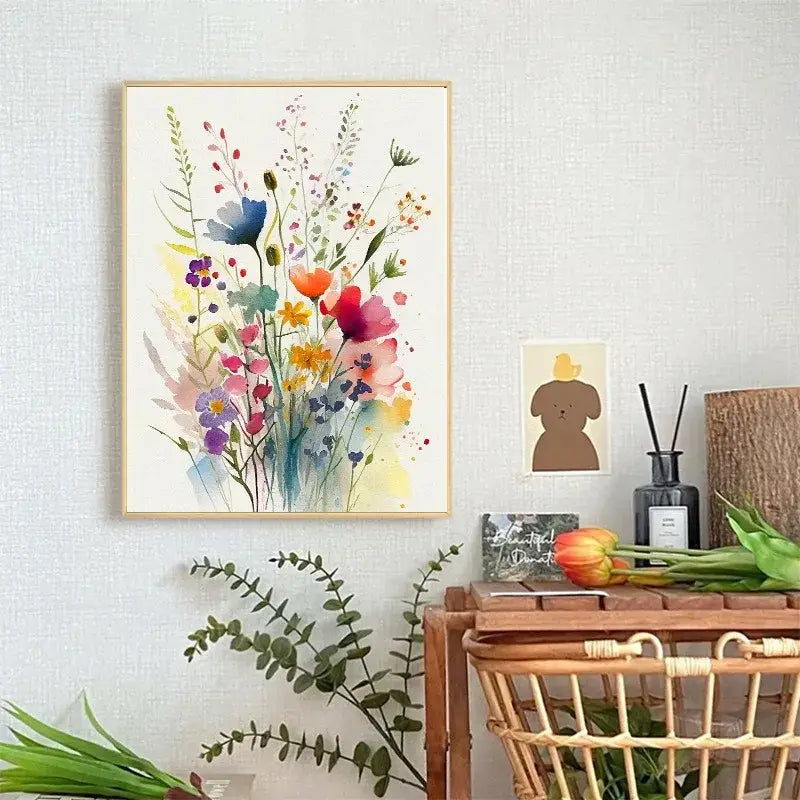 A vibrant wildflowers watercolour poster in a light wooden frame featuring colorful blossoms on canvas wall art
