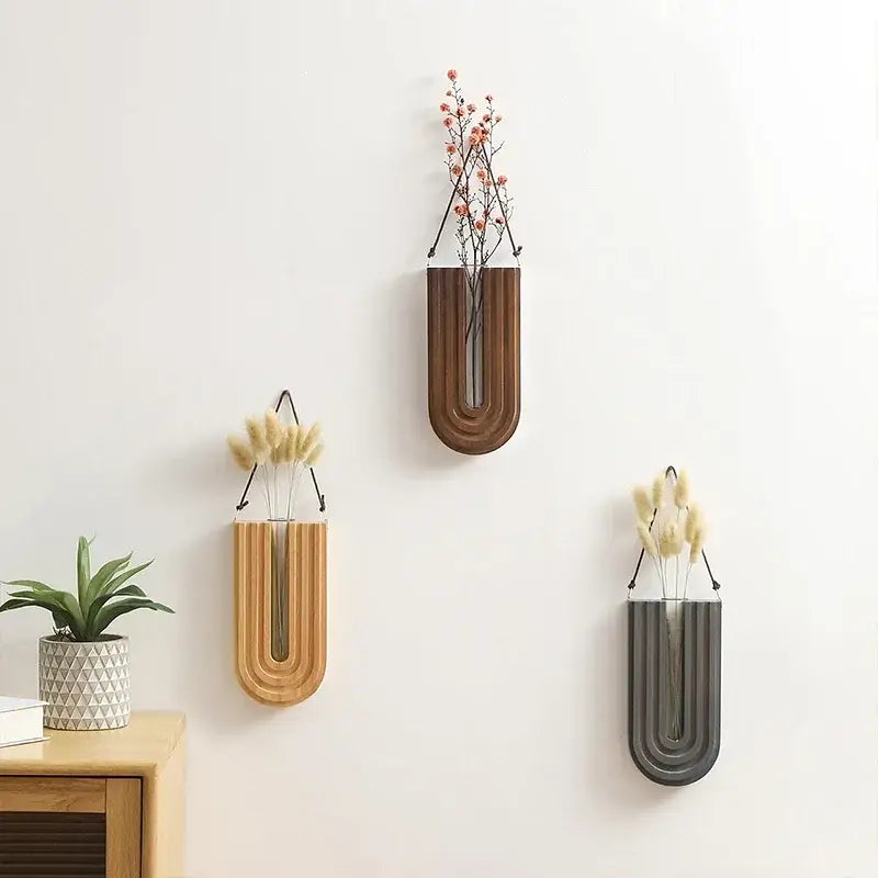 DecorBites wooden flower vase wall mount holder with three u-shaped vases in wood metal and matte gray finishes holding dried flowers