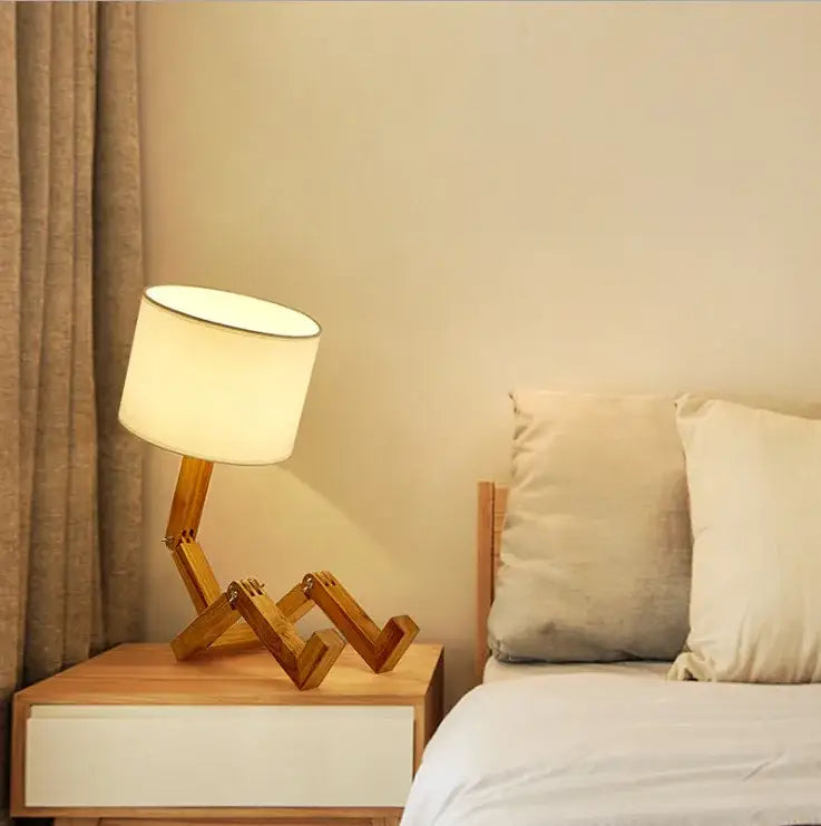 Decorbites™ wooden robot shape creative table lamp with off-white fabric shade and angular wooden legs for indoor use