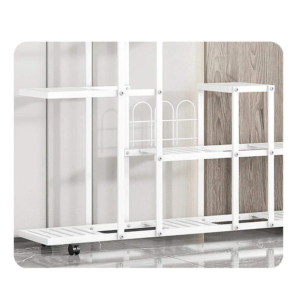 White wrought iron plant stand with multiple shelves decorative arched accents and wheels by decorbites