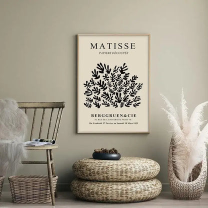 Beige-framed wall art featuring black cut-paper artwork by matisse titled papiers découpés in elegant serif typography