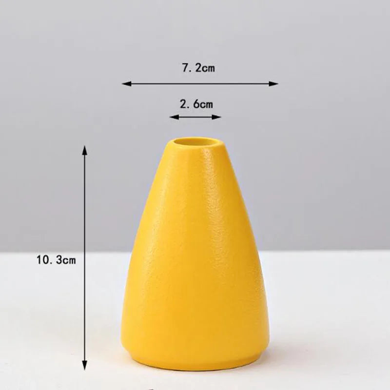 A sleek matte yellow porcelain flower vase by DecorBites with a tapered conical shape for home decor