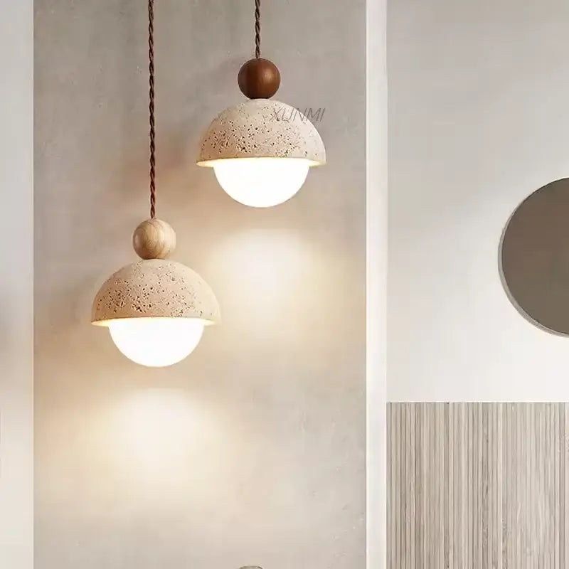 Decorbites yellow travertine stone pendant light with textured beige concrete domes and wooden accents for kitchen island