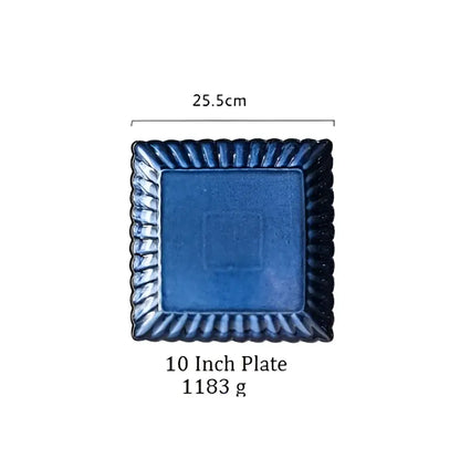 A klin glazed ceramic rectangle sushi tray with deep blue glaze and ornate twisted border from decorbites klin glazed collection