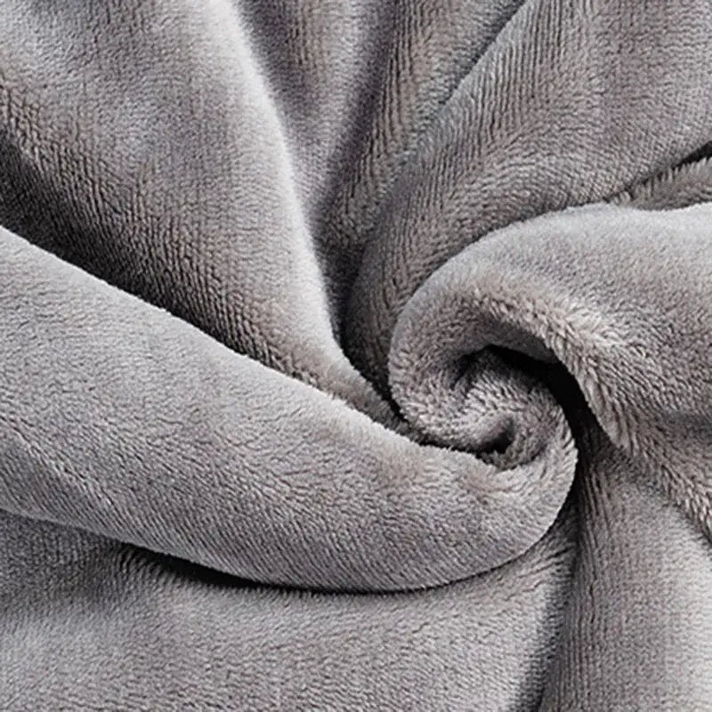 Deep blue and white double-layer lamb fleece blanket with a plush soft gray fleece cozy textured surface for bedroom use