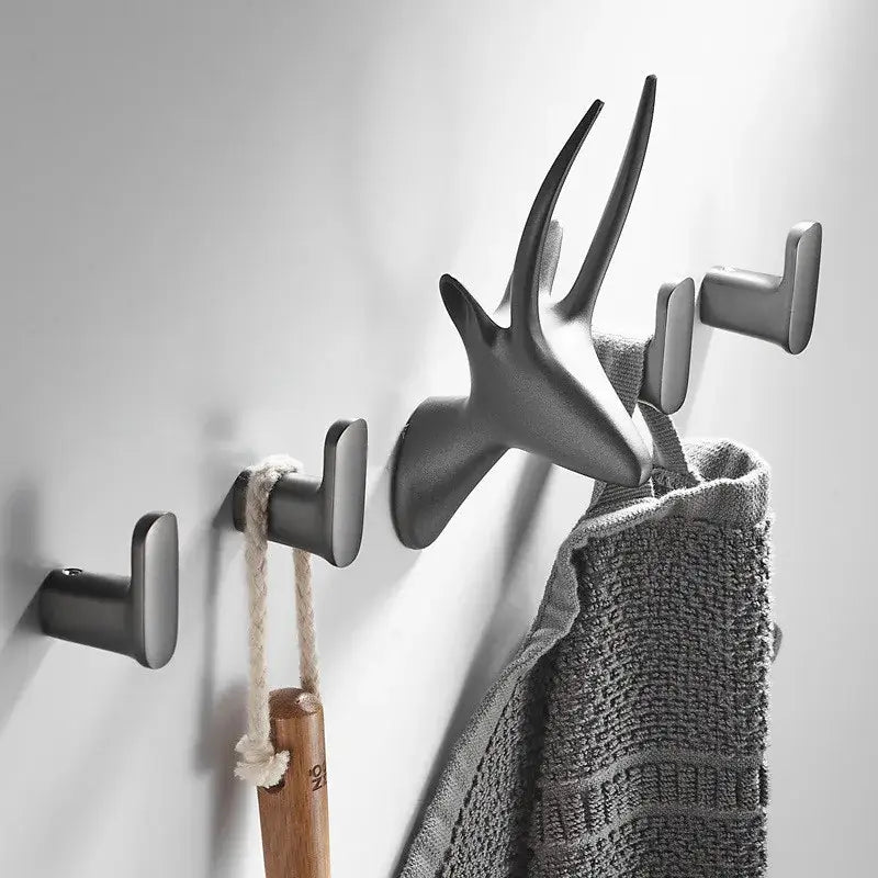 Matte black deer-head robe hook with sleek antler design and integrated towel rack for decorbites gun grey bathroom decor