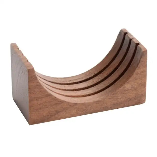 A sleek medium-brown wooden knife block with curved tiers complements denim blue and black decorbites espresso puck screen coasters