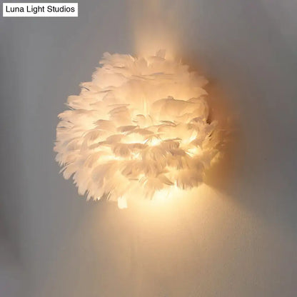 Designer feather white and grey wall sconce wall lamp featuring soft warm glow made from layered white feathers
