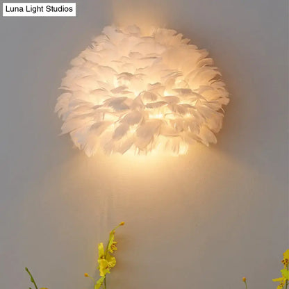 Designer feather white and grey wall sconce with soft feathers and warm glow for bedroom wall lamp lighting