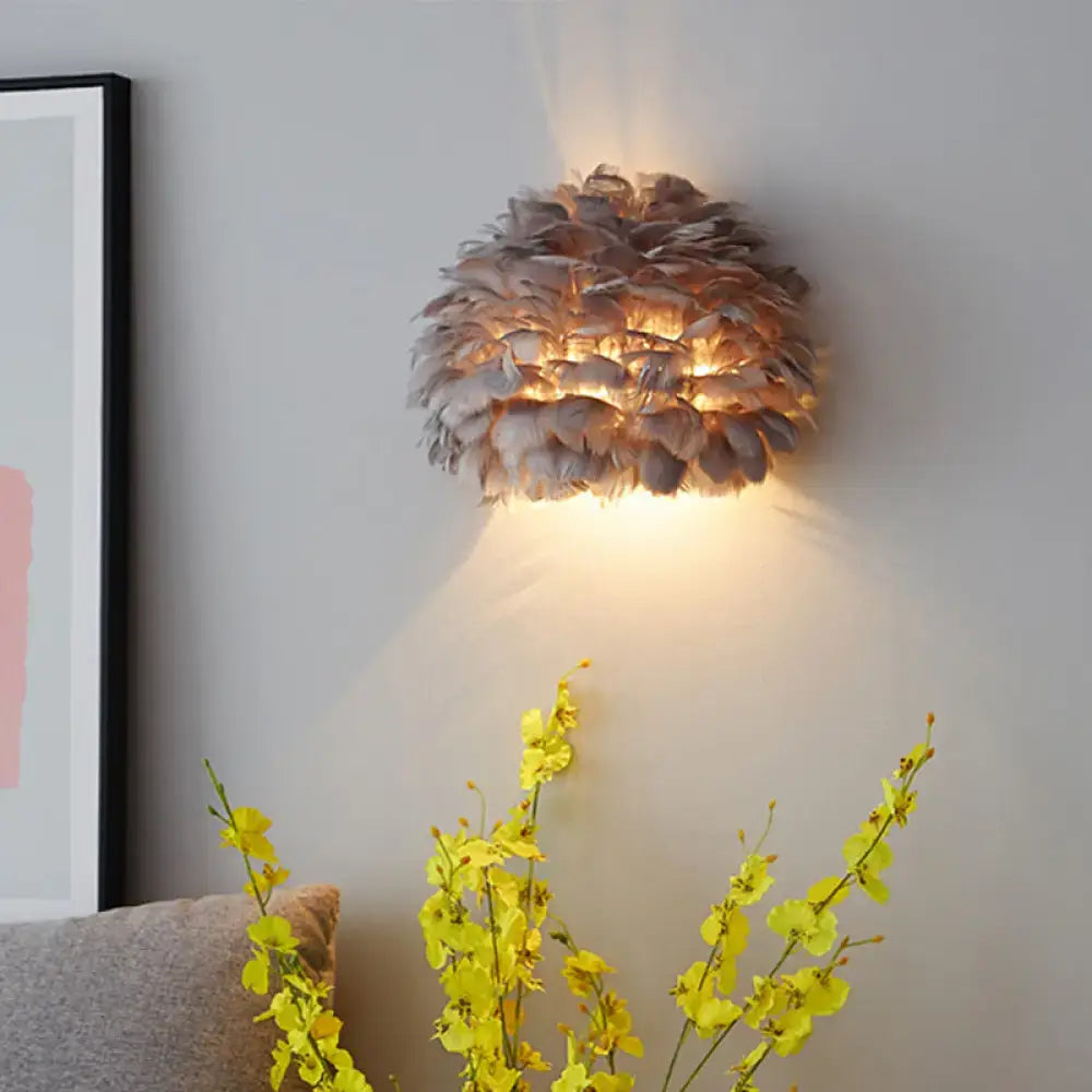 Warm-toned designer feather white and grey wall sconce with soft layered design for bedroom wall lamp lighting
