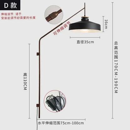 Black matte wall lamp with curved brass-toned arm and adjustable height for decorbites gold black swing style lighting