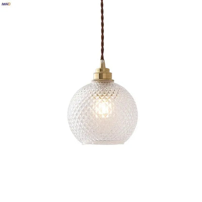 Clear glass globe led pendant light with diamond-cut pattern brass hardware and twisted brown cord for kitchen decorbites pendant light