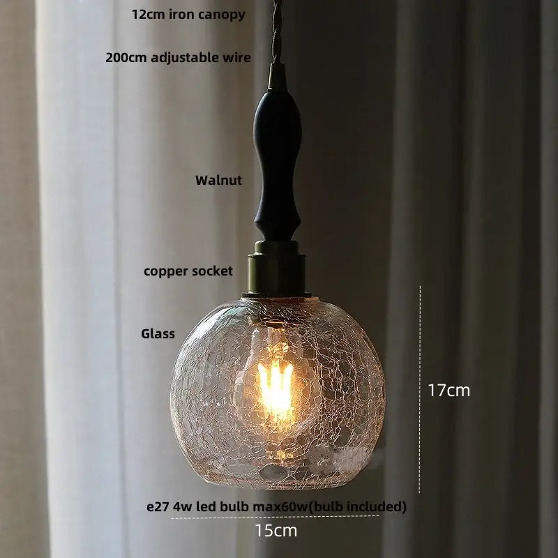 Diamond cut glass globe led pendant light with warm-toned crackled glass, walnut iron canopy, and copper socket decorbites glass globe