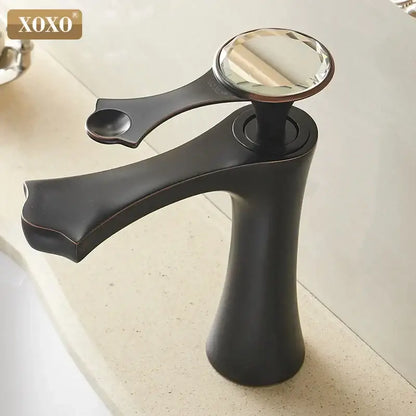 Xoxo basin faucet in diamond golden black with a sleek matte finish and a crystal handle for bathroom use