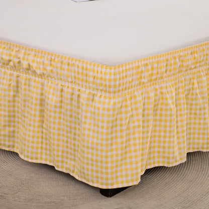 Yellow and white gingham check bed skirt with ruffled hem featuring elastic band and diamond lattice ruffled design
