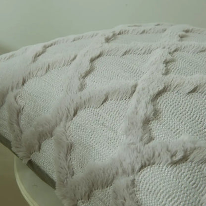 A plush light gray throw blanket with diamond solid embroidery cushion cover and textured soft fuzzy border