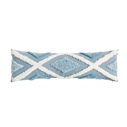 Light blue diamond tufted blue cushion cover with white fringed geometric patterns and tassels for living room decor