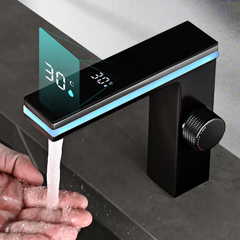 Black single hole modern brass bathroom basin faucet with digital temperature display and blue led cold water lighting accents