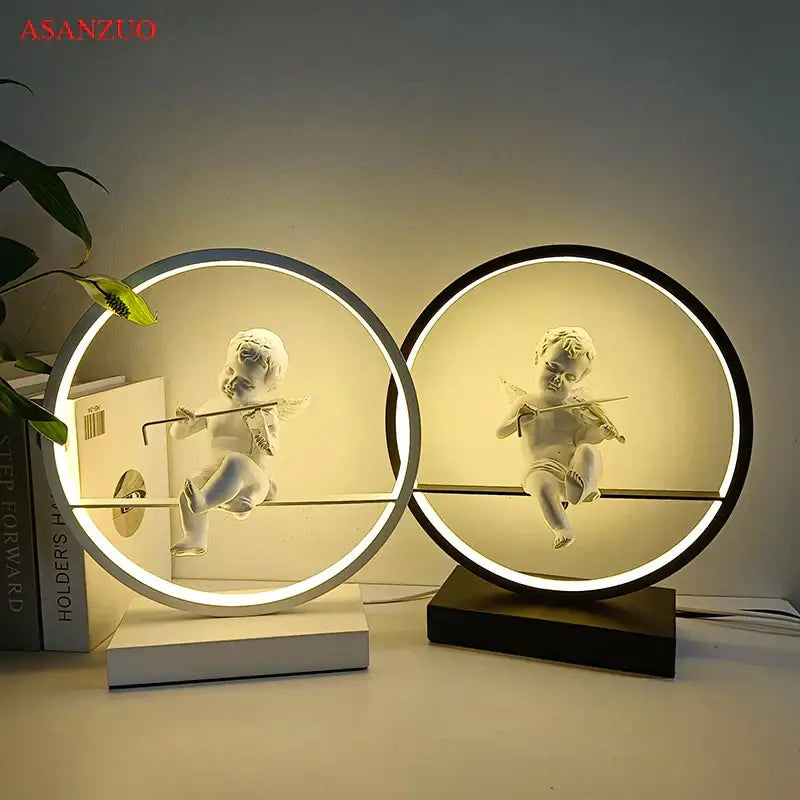 Two circular decorbites dimmable angel table lamps with white cherub figurines playing instruments for bedroom decor