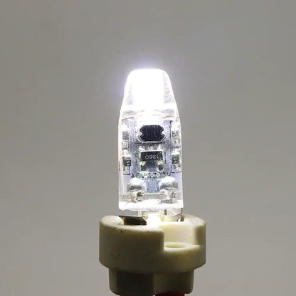 Dimmable g4 led bulb with clear glass and visible circuitry emitting bright white light for living room decorbites dimmable