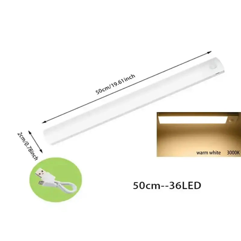 A sleek white 50cm decorbites dimmable led motion sensor strip light with warm white illumination for kitchen decor