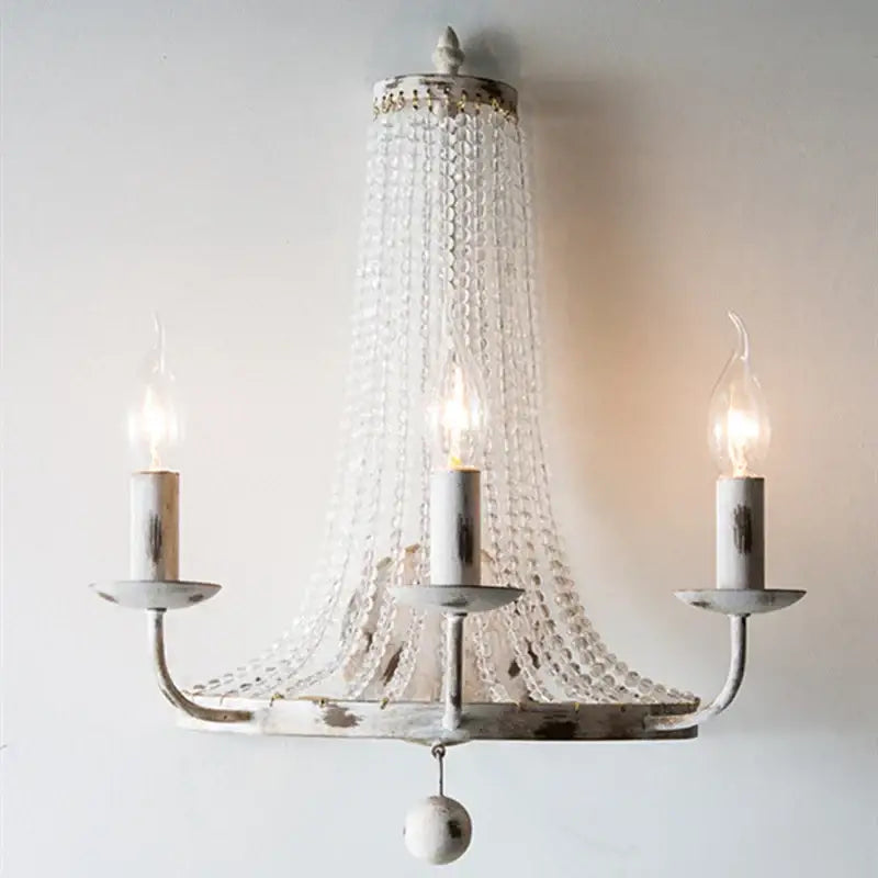 Distressed white crystal tassel wall lamp with three candle-style bulbs and cascading clear crystal beads for bedroom decorbites crystal tassel decor