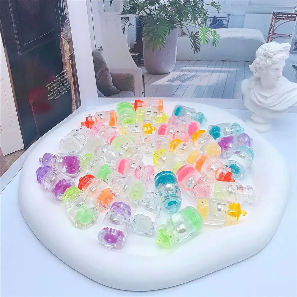 A collection of colorful translucent plastic diy heart pearl shell miniature wishing bottles for bedroom decor