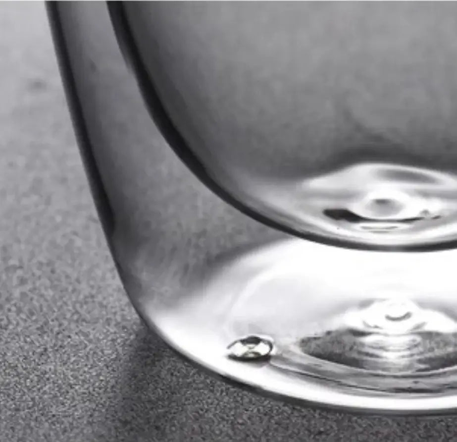 Clear glass wine goblet with rounded base and subtle stem reflection for double deck insulated glass mug use
